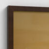 Close-up detail of slim dark brown wooden picture frame holding botanical floral artwork with warm tan background. Corner view showing the clean modern profile of the frame against white wall, highlighting the quality craftsmanship and elegant finish that complements the white flower botanical print inside.