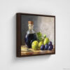 Still life oil painting framed canvas print featuring green grapes, dark wine bottle with cork, and blue grapes arranged on wooden surface, displayed in brown floating frame against white background