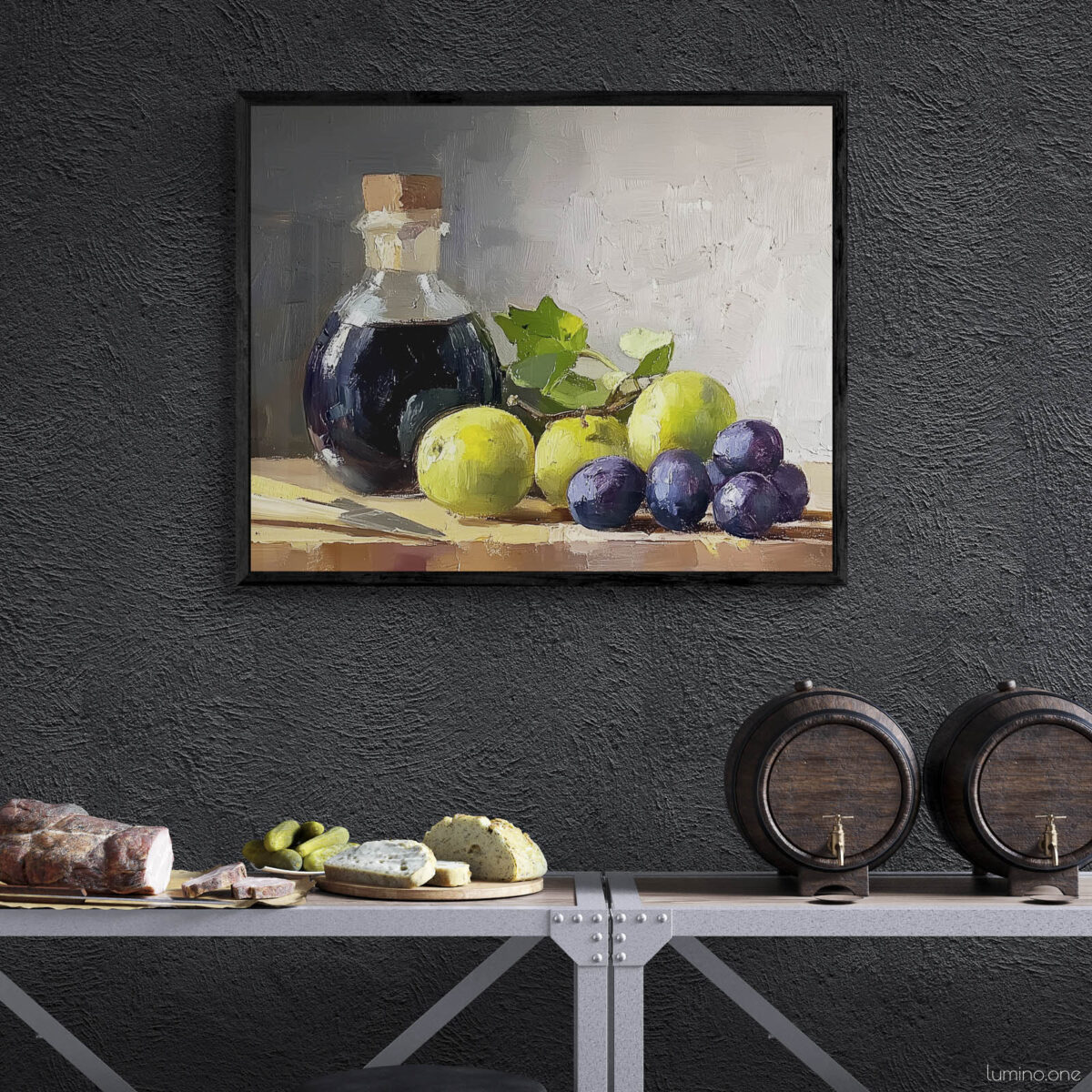 Framed still life oil painting print featuring green grapes, dark wine bottle with cork, and blue grapes arranged on wooden surface, displayed in wine cellar or bar area with dark textured walls above industrial metal shelving with cheese board and wine barrels
