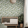 Serene nursery featuring white water lily botanical wallpaper accent wall, mid-century modern natural wood crib with white bedding, woven rattan sphere pendant light, potted fiddle leaf fig tree, and sage green ottoman creating a calming nature-inspired baby room