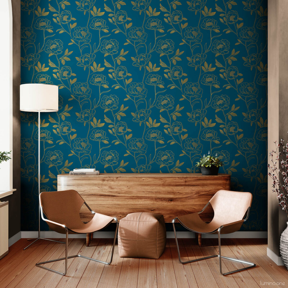 Modern sitting room accent wall with dark teal and gold peony peel and stick wallpaper, styled with two tan leather sling chairs, a walnut credenza, white floor lamp, and dried cherry blossom branches on wood floors