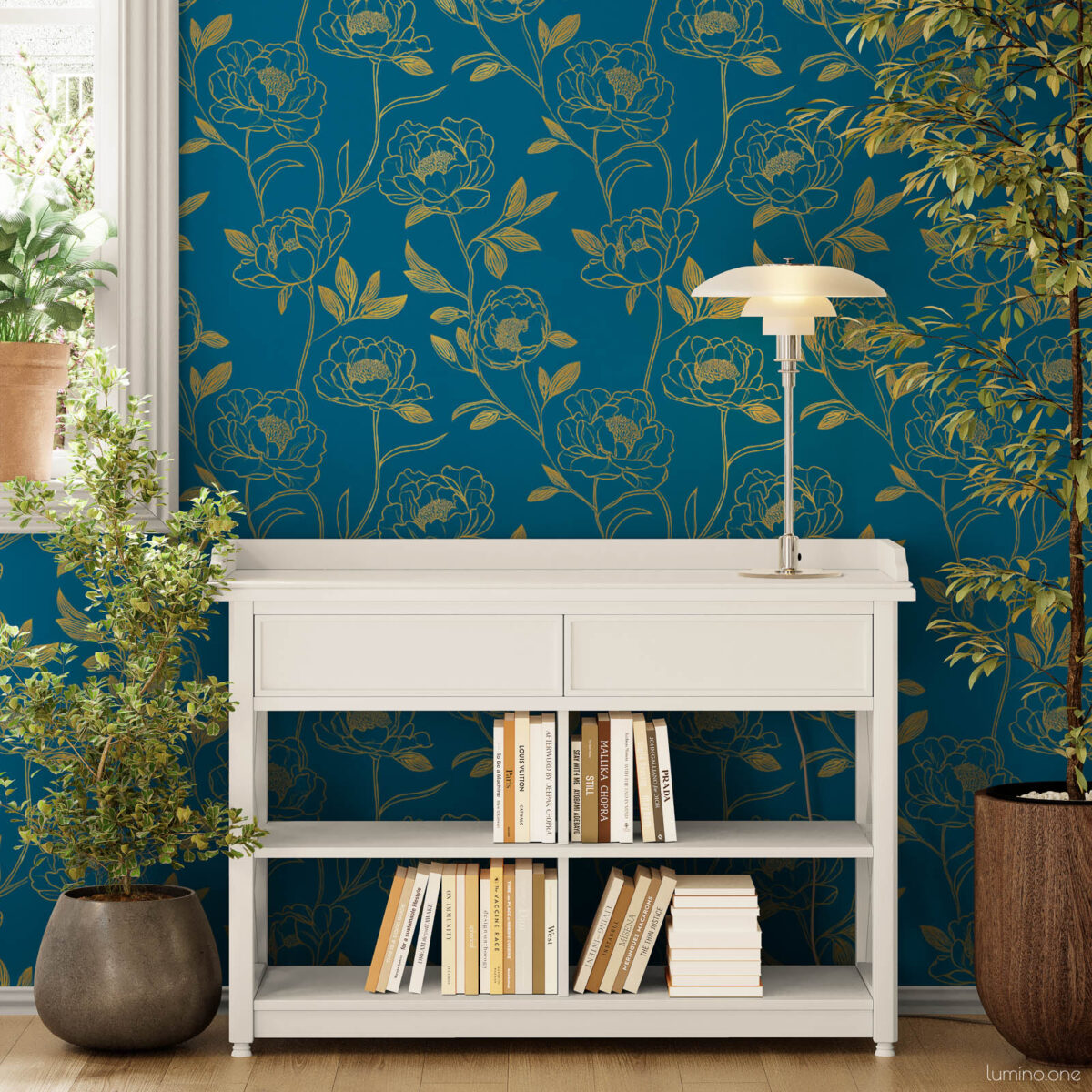 Bright entryway accent wall with dark teal and gold peony peel and stick wallpaper, styled with a white console bookshelf, silver table lamp, and lush indoor plants on wood floors